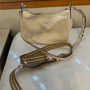 Kate spade purse. About 9 inches tall 12 inches wide and 3 inches wide at base.